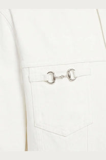 Silver horsebit buckle detail on Gucci men’s white denim jacket pocket in white material