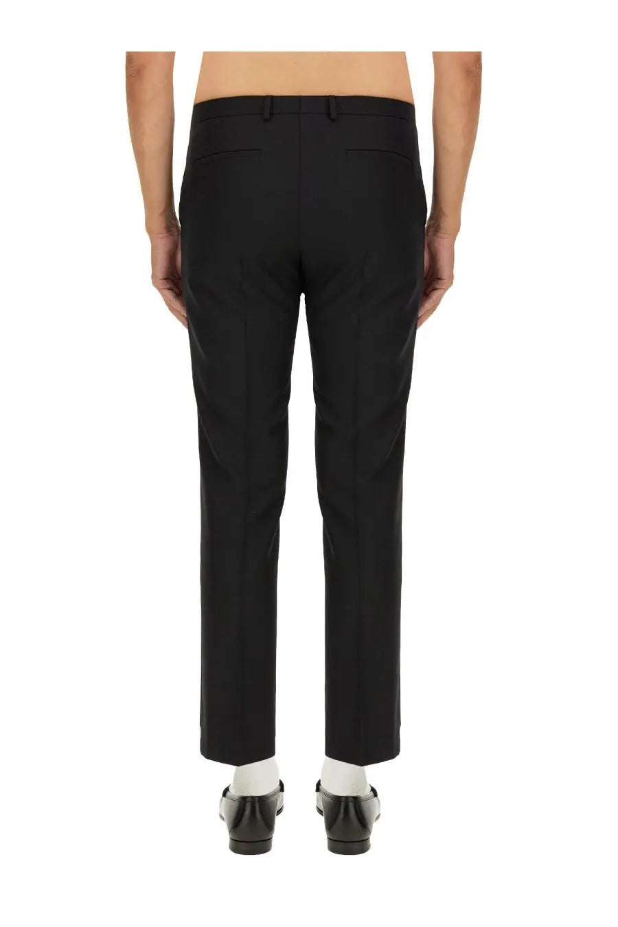Black gucci men’s wool blend twill pants shown from the back with tailored straight-leg cut and subtle creasing