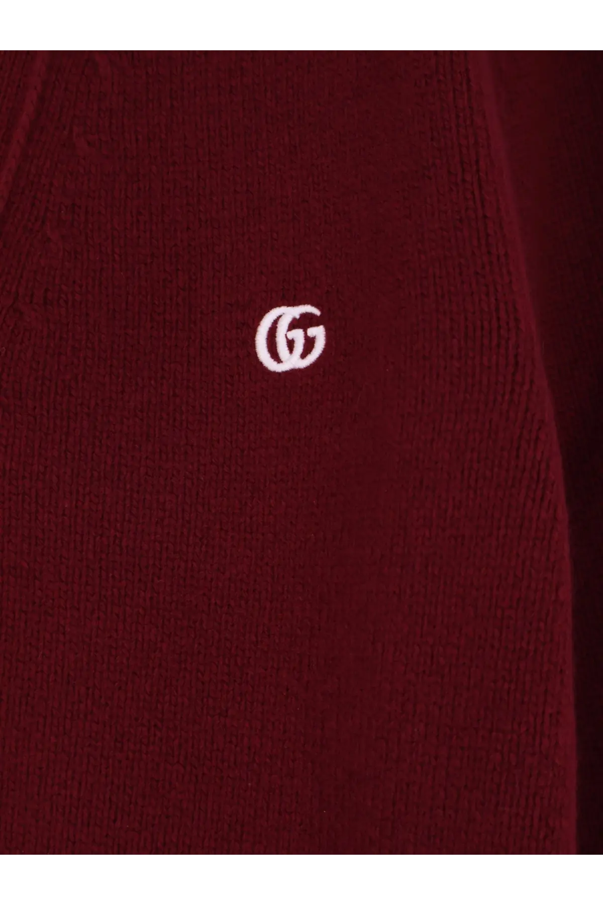 A burgundy knitted gucci men’s wool and cashmere cardigan with a white embroidered gucci logo on the front