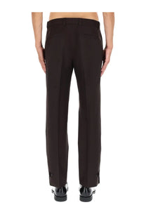 Gucci men’s black wool gabardine pants with tailored fit, sleek straight-leg cut, and subtle side pockets