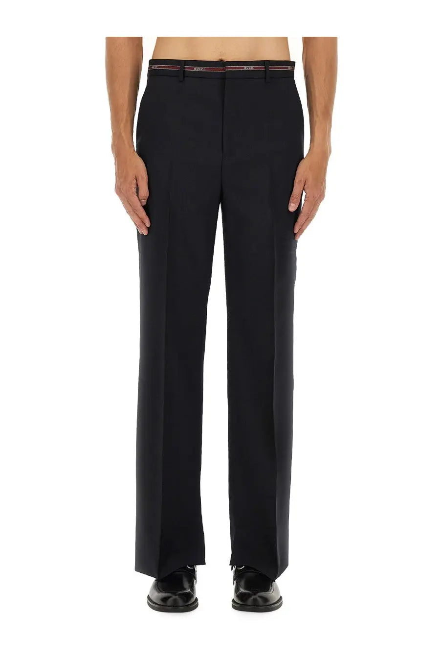 Black tailored wool trousers with slim fit pleats and a red and white branded belt by gucci mens wool pants blue