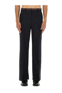 Black tailored wool trousers with slim fit pleats and a red and white branded belt by gucci mens wool pants blue