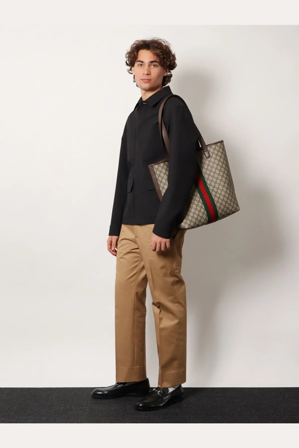 Beige and brown gucci tote bag with red and green striped shoulder strap paired with gucci mens wool shirt jacket grey