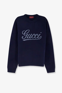 Navy blue Gucci men’s wool sweater with silver embroidered logo across the chest in a grey style