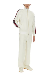 Gucci men’s zippered jacket in cream with red and black striped accents on sleeves and side seams