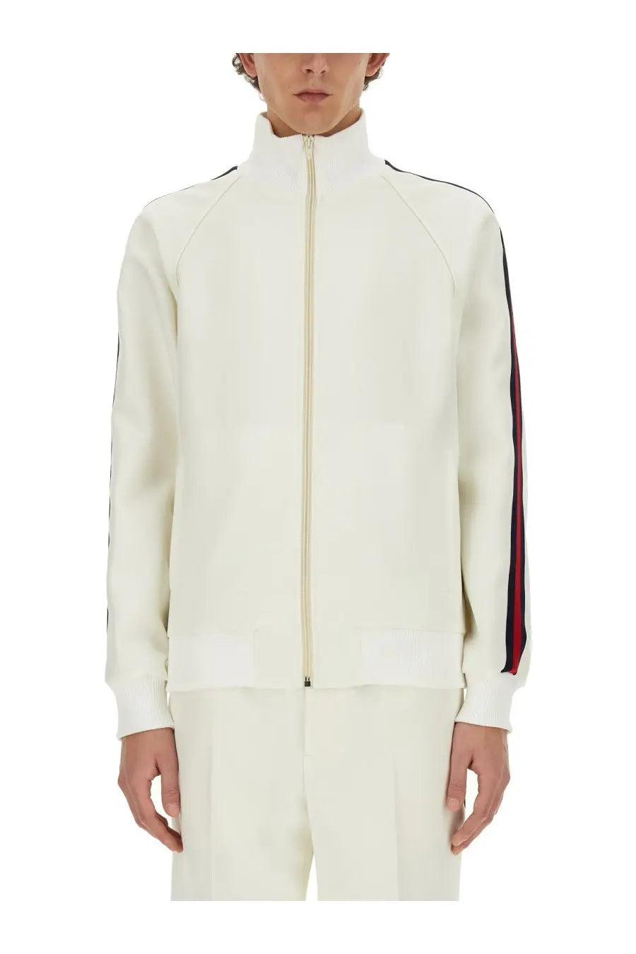 Gucci men’s cream-colored zip-up track jacket with black and red striped sleeves high collar and ribbed cuffs