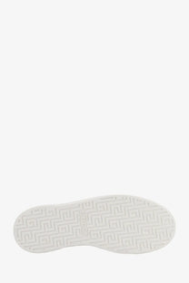 White rubber sole with geometric pattern and gucci embossed on the back of green ace leather sneakers for women