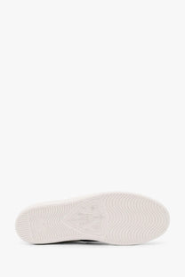 White rubber sole with subtle wave pattern and embossed logo detail on gucci women’s ace leather sneakers verd