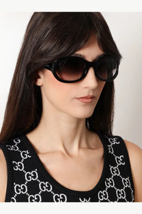 Black Gucci women’s acetate sunglasses with bold rounded frame and gradient lenses for stylish sun protection