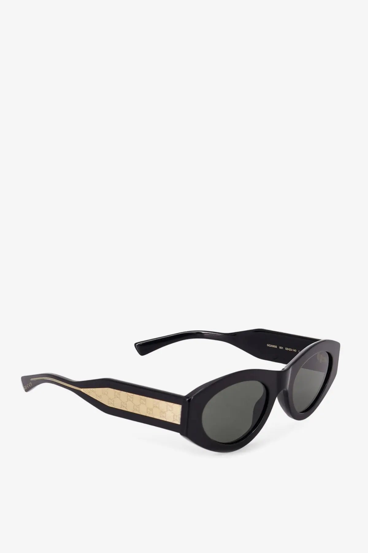 Black cat eye acetate sunglasses with gold gucci logo pattern on temple arms and dark gray lenses for women