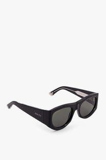 Gucci women’s acetate sunglasses in black with dark gray lenses and a sleek modern rectangular frame
