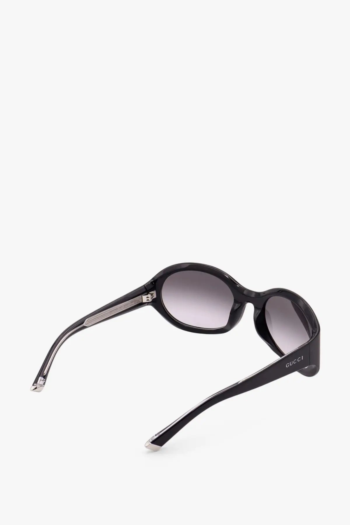 Black gucci womens acetate sunglasses with oval frames and gradient gray lenses