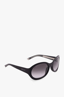 Black gucci women’s acetate sunglasses with oval frames and gradient gray lenses for stylish sun protection