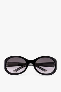 Gucci women’s black acetate sunglasses with black oval frame and gradient gray lenses in a sleek modern design
