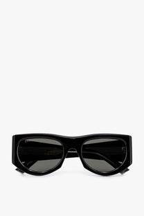 Gucci women’s black acetate sunglasses with rectangular frames and dark gray lenses with a glossy finish