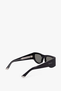 Black gucci women’s acetate sunglasses with sleek modern frames and dark gray lenses for stylish sun protection