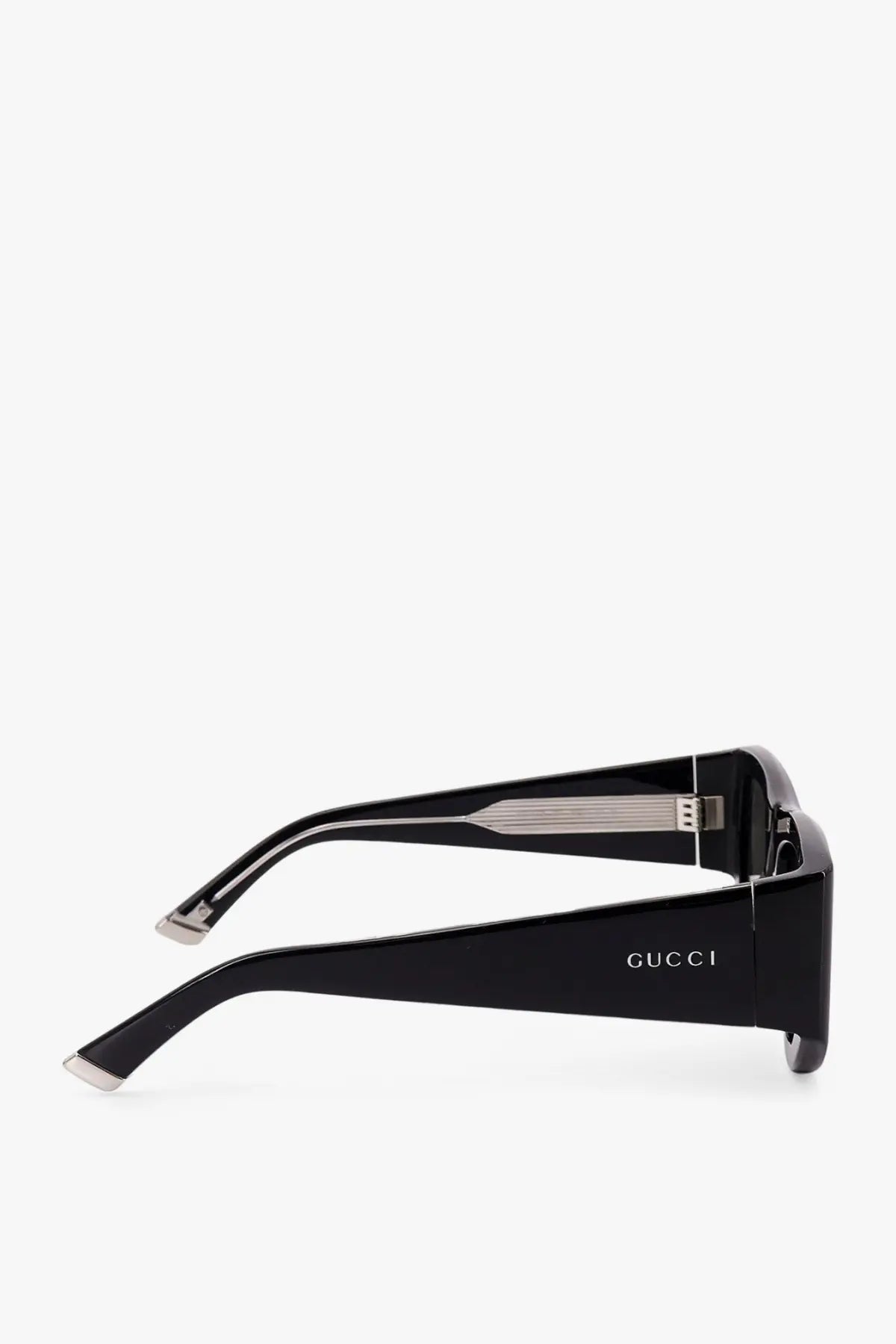 Gucci women’s acetate sunglasses in black with sleek rectangular frames and metallic temple accents