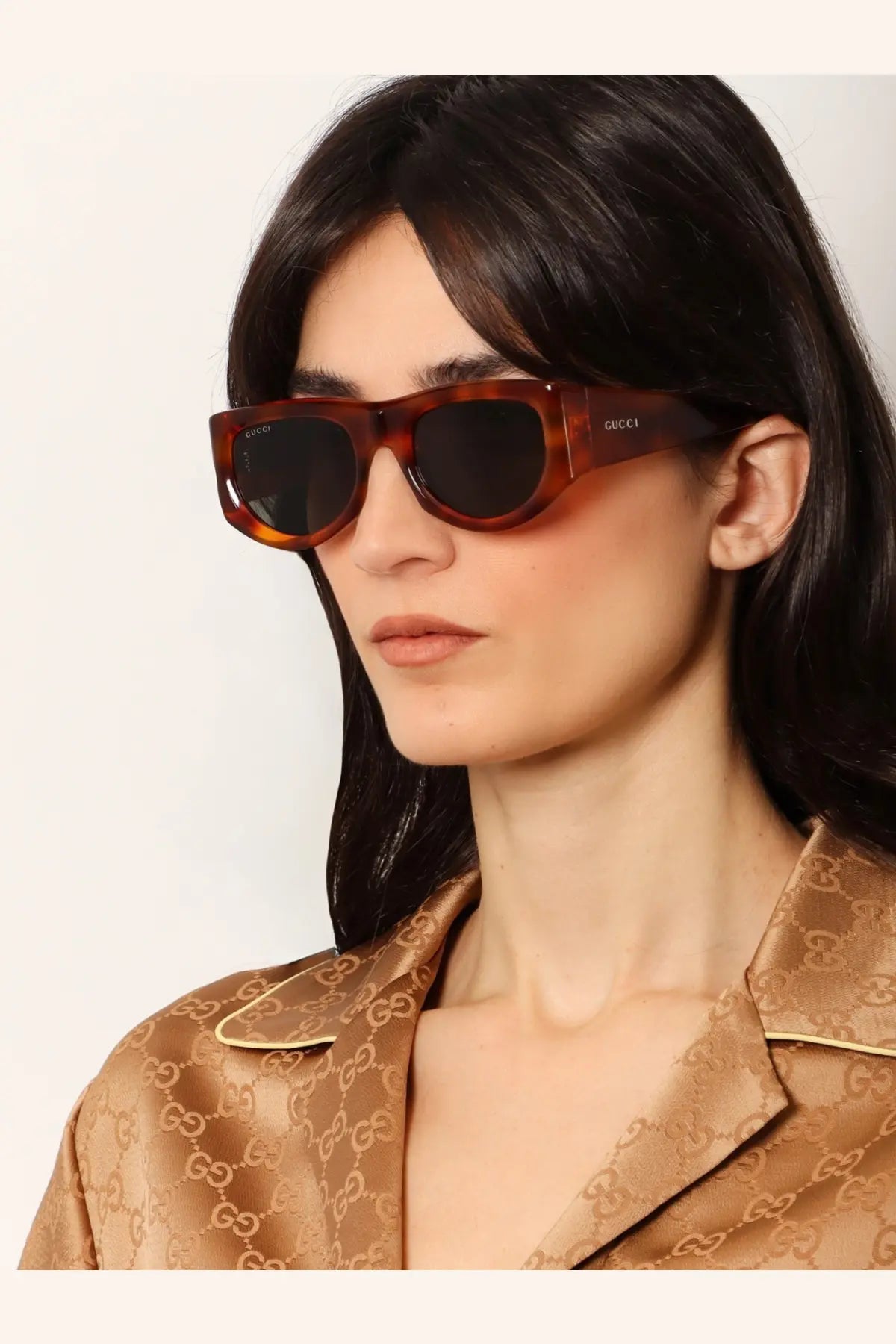 Gucci women’s acetate sunglasses in tortoiseshell brown with dark lenses and a sleek rectangular frame