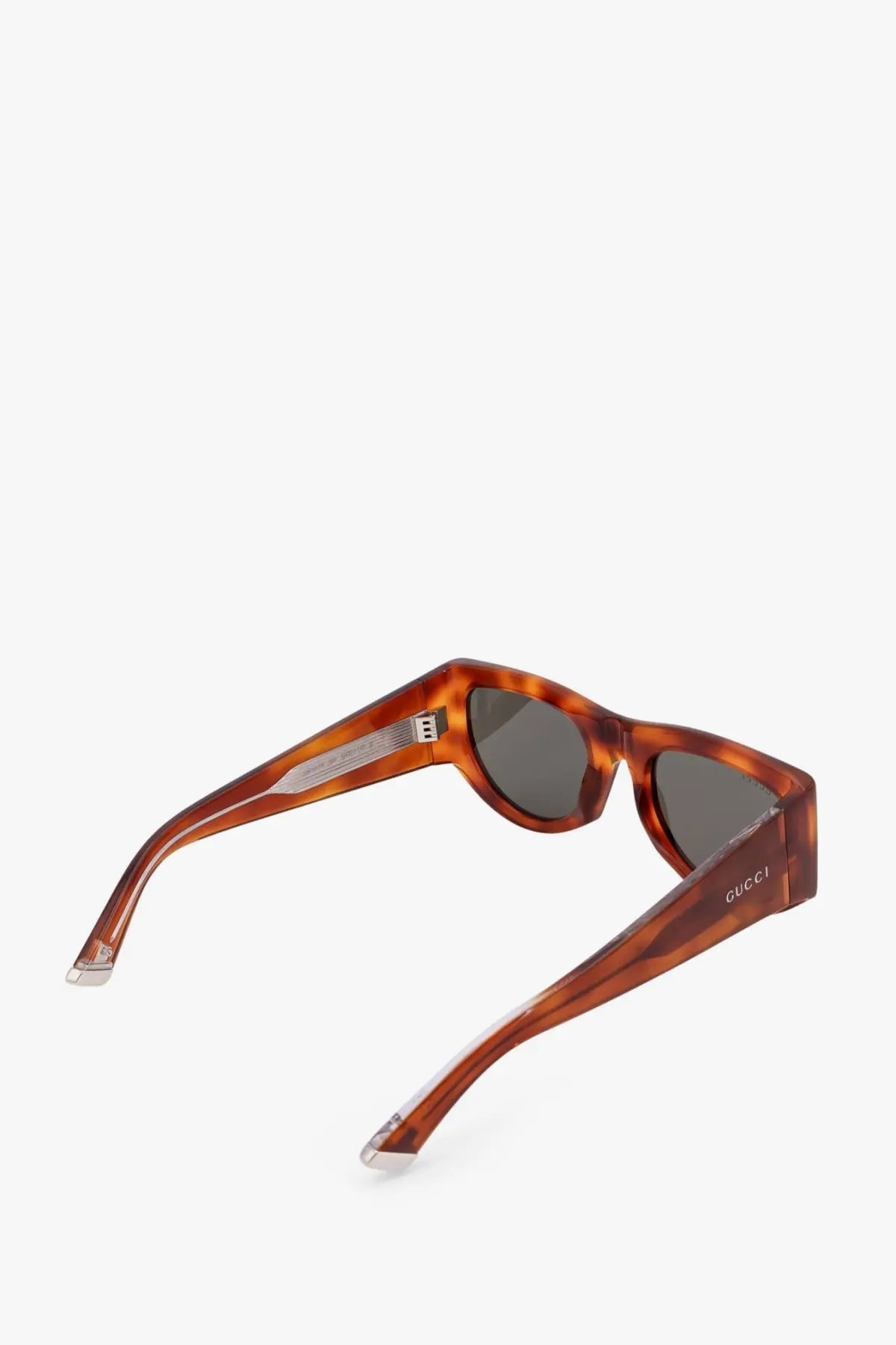 Gucci women’s tortoiseshell acetate sunglasses with brown frames and dark gray lenses for stylish sun protection