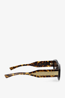Gucci women’s acetate sunglasses in brown tortoiseshell with textured gold accent on the temple