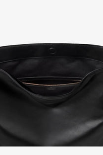 Black leather gucci women’s large shoulder bag with a sleek minimalist design and subtle gold-tone zipper