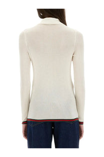 Gucci women’s cream-colored ribbed knit cashmere and silk polo sweater with collar and red-green striped hem trim