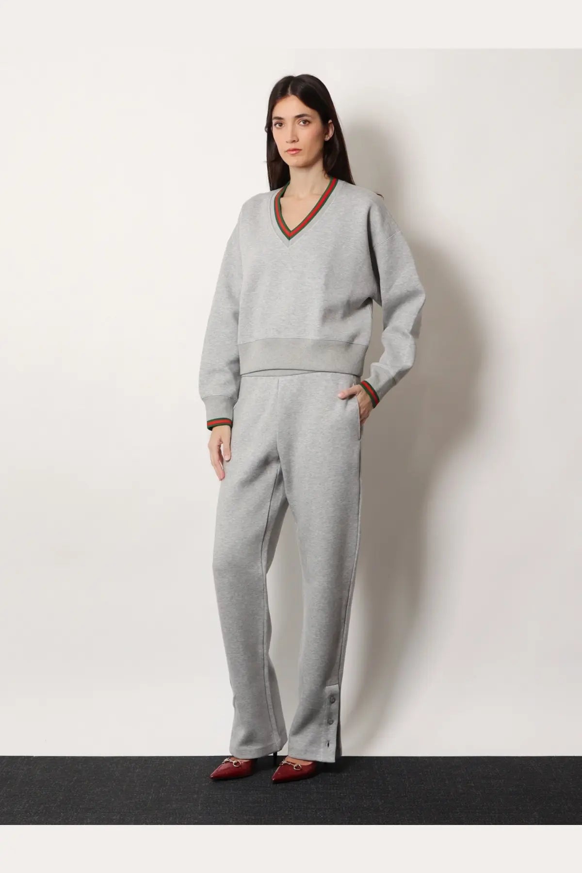 Gucci women’s gray cotton blend trouser with v-neck sweatsuit featuring brown trim on neckline and cuffs