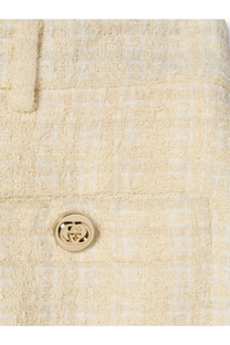Cream-colored tweed jacket with gold-tone interlocking gg button paired with gucci women’s white cotton blend trousers