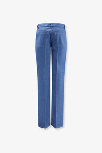 Blue denim gucci women’s cotton jeans with straight leg cut and visible stitching on back pockets view from behind