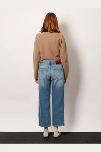 Blue denim Gucci women’s cotton jeans with a straight-leg cut and red brand patch on the waistband back side