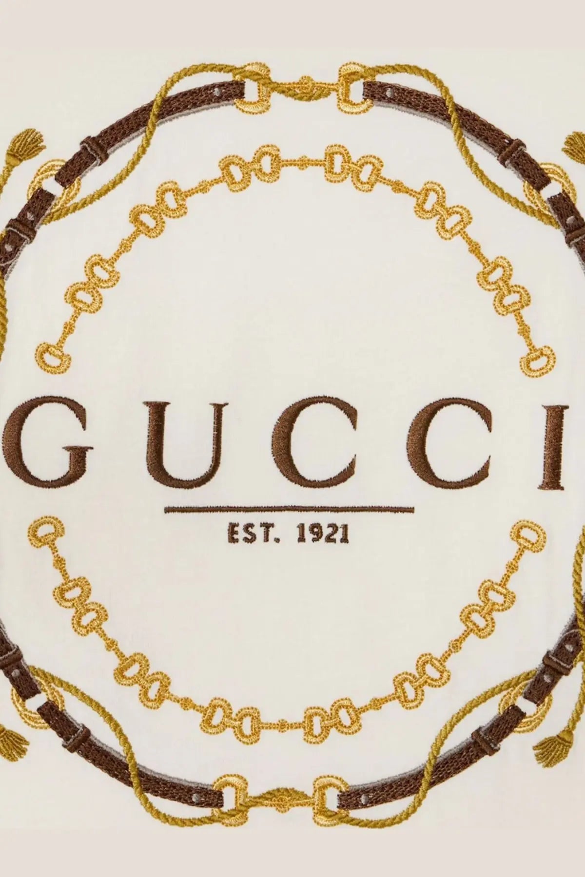 Gucci women’s white cotton jersey shirt with embroidered Gucci logo and brown gold chain belt motifs on fabric