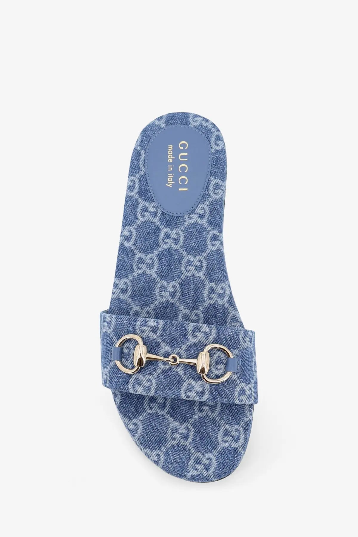 Blue denim Gucci women’s slide sandal featuring a metallic horsebit buckle for casual stylish wear