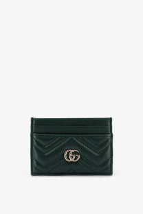 Dark green quilted leather Gucci women’s GG Marmont card holder with gold-tone interlocking GG logo