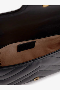 Gucci women’s GG marmont mini black quilted leather crossbody bag with gold hardware and tan interior lining