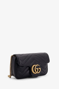 Gucci women’s gg marmont mini leather crossbody bag in black with quilted design gold interlocking gg logo clasp and chain strap