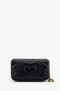 Gucci women’s GG Marmont mini black leather crossbody bag with quilted heart shape and gold-tone chain strap