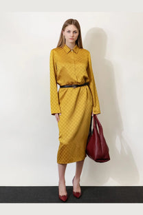 Golden Gucci women’s satin chemisier dress with long sleeves and repeating monogram pattern
