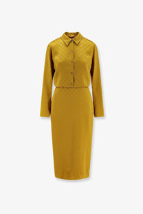 A mustard-yellow gucci satin chemisier dress with button-down collar and embossed gg monogram pattern