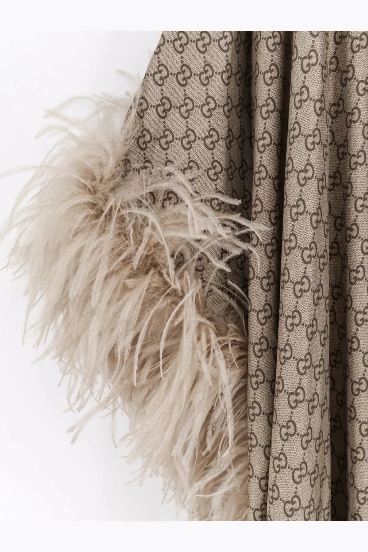 Beige Gucci womens coat with brown interlocking GG silk pattern and feathered trim from GG silk Kaftano dress collection