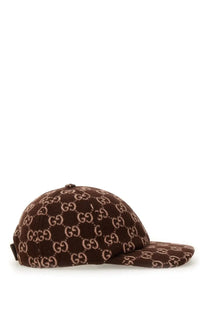 Gucci women’s brown wool baseball hat featuring a repeating beige interlocking GG logo pattern