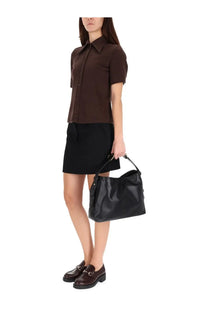 Black leather hobo bag with gold tone hardware paired with gucci women’s half sleeve brown shirt