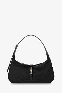 Gucci women’s Jackie slim GG canvas shoulder bag in black with repeating monogram and silver-toned hardware