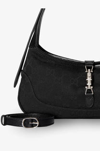 Black gucci women’s jackie slim gg canvas shoulder bag with subtle monogram pattern and silver toned hardware