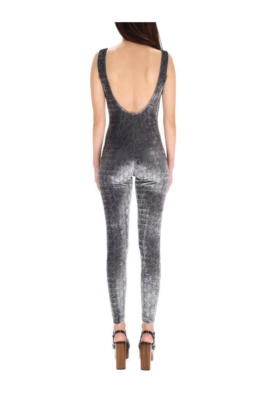 Gucci women’s jumpsuit grey shown from the back with a sleek silver and black snakeskin velvet deep cutout design