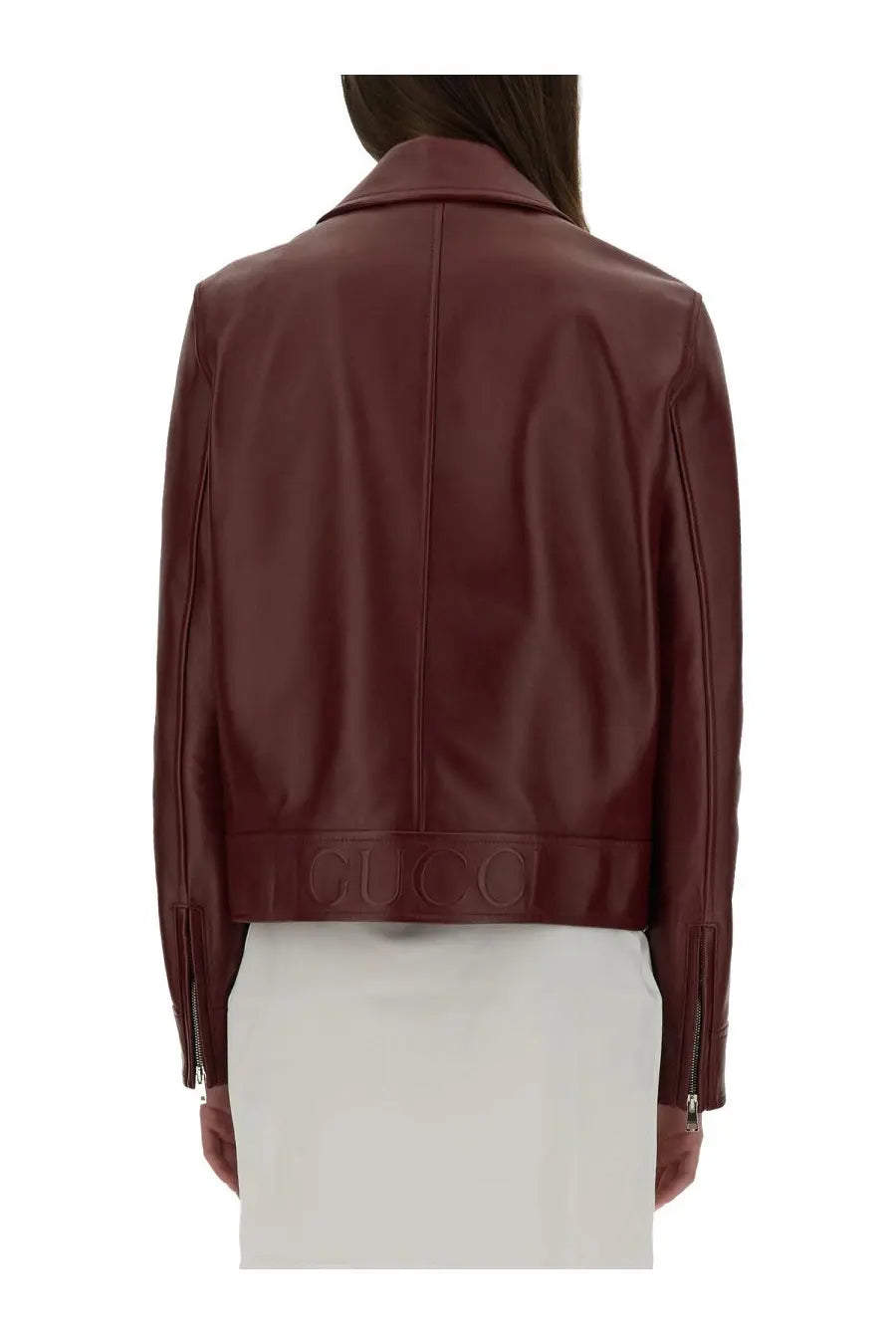 Gucci women’s burgundy leather biker jacket with cropped silhouette and embossed logo at the hem