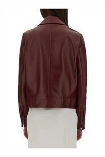Gucci women’s burgundy leather biker jacket with cropped silhouette and embossed logo at the hem