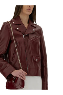 Gucci women’s glossy burgundy leather biker jacket with silver zippers and snap buttons