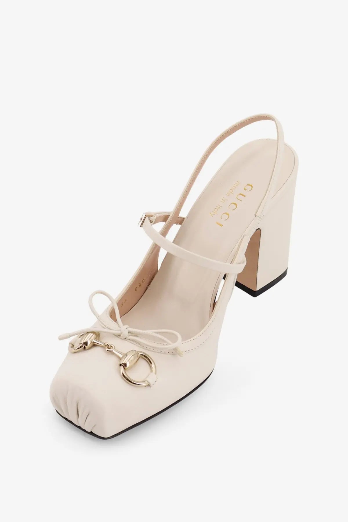 Cream-colored Gucci women’s leather écolleté pump with square toe and gold-tone horsebit slingback detail