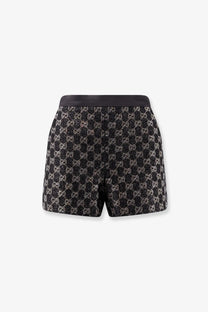 Black and silver Gucci women’s lightweight lamé wool tweed shorts with a shimmering textured pattern