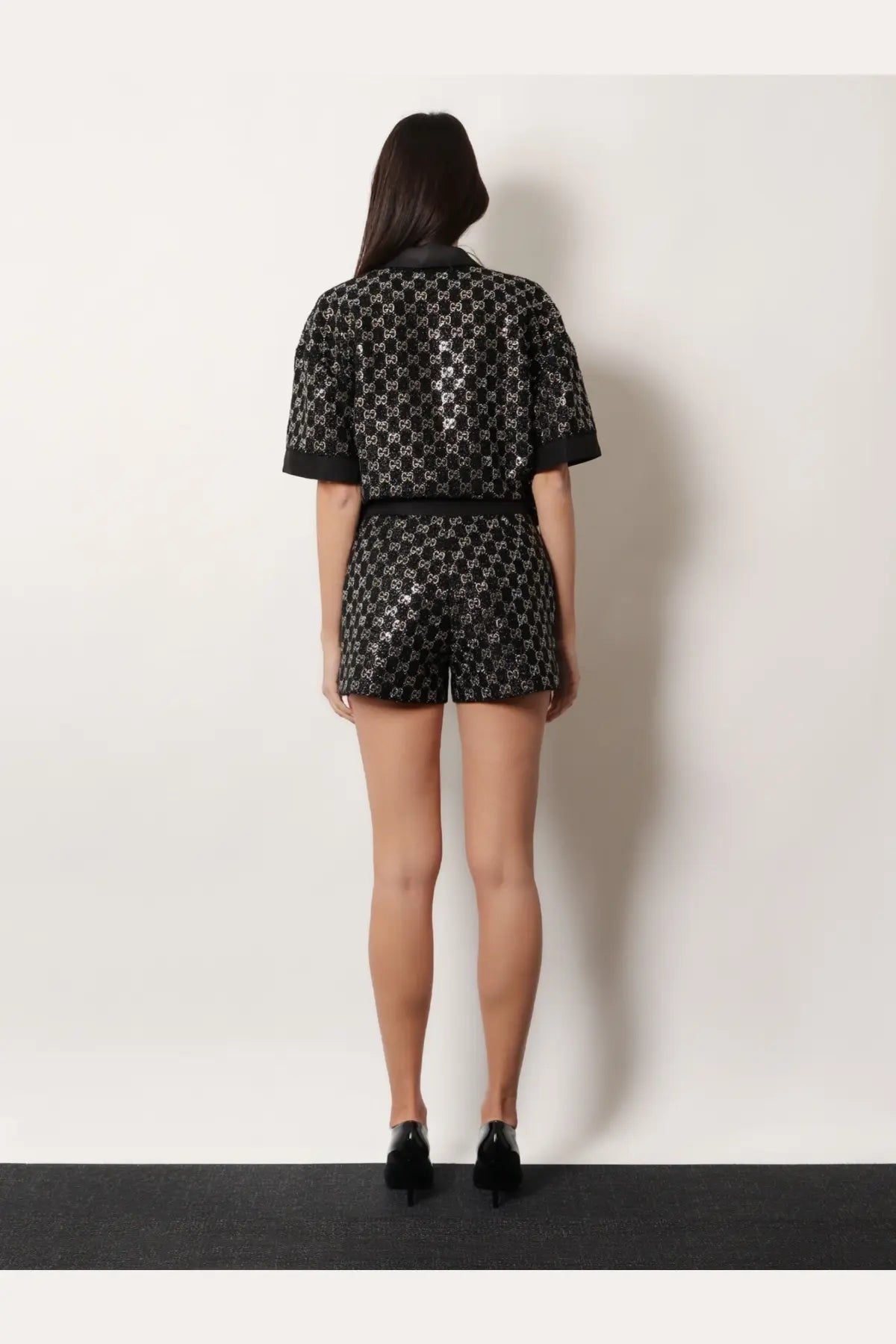 Gucci women’s lightweight lamé wool tweed shorts romper in black with silver GG logo pattern and matching belt
